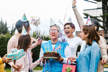 Wall Mural - latin grandmother and women Family Celebrating a happy Birthday in Mexico