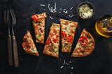 Fototapeta  - Pizza chunks with cheese on dark