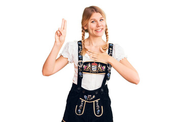 Young beautiful blonde woman wearing oktoberfest dress smiling swearing with hand on chest and fingers up, making a loyalty promise oath