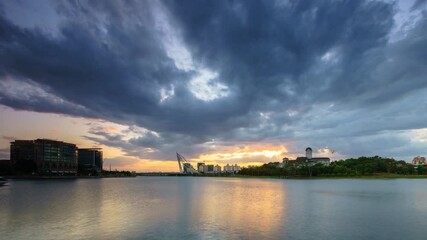Wall Mural - Footage of Timelapse a Moving cloud during sunset near the building and bridge.
