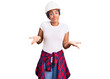 © Krakenimages.com - Young african american woman with braids wearing hardhat and builder clothes clueless and confused expression with arms and hands raised. doubt concept.