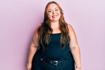 Plus size caucasian young woman wearing casual clothes over pink background with a happy and cool smile on face. lucky person.