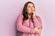© Krakenimages.com - Beautiful brunette plus size woman wearing casual winter sweater thinking concentrated about doubt with finger on chin and looking up wondering