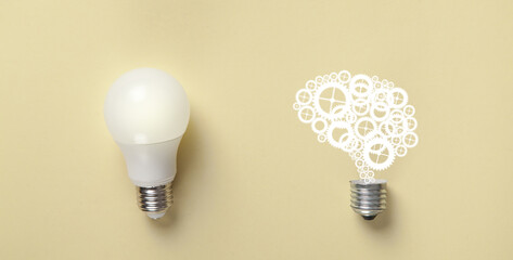 Wall Mural - Light bulb and human brain on the yellow background. Idea. Brainstorming