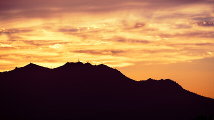 Wall Mural - Colorful sunset in East San Francisco Bay Area, with brightly colored clouds covering Mt Diablo summit; Contra Costa County, California