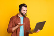 © deagreez - Photo portrait of male assistant speaking video call in headphones with mic laptop isolated bright yellow color background