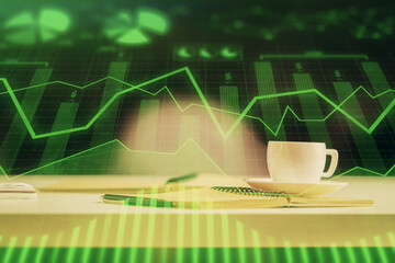 Multi exposure of forex graph drawing and desktop with coffee and items on table background. Concept of financial market trading