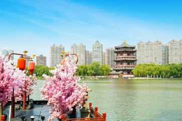 Sticker - Ancient buildings by the lake: Pagoda, Xi'an, China.