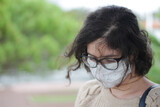 Fototapeta Desenie - portrait of a young woman with a face mask 