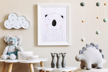 Stylish Scandinavian Nursery Interior With Mock Up Photo Frame, Toy, Design Furniture, Pillows And Accessories. Beautiful Decoration On The Beige Background Wall. Home Decor For Children Room.