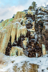 Canvas Print -  Frozen waterfall in the winter forest