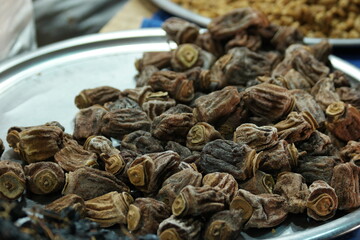 Wall Mural - Pile of dried figs close up. Heap of natural dried fruits at market counter. Organic food concept.