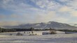 Zeitraffer Allgäuer Vorberge mit Alpspitze im Winter am späten Nachmittag mit Zweischichtwolken bis Sonnenuntergang