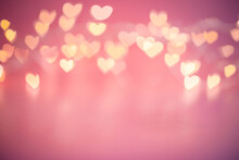 Blurred Hearts Lights. Valentines Day Pink Bokeh Background