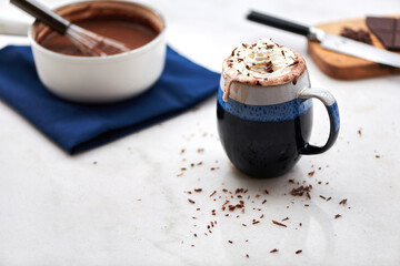 Homemade Hot Chocolate with Whipped Cream and Chocolate Curls on Marble Table