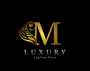 Golden initial M letter luxury beauty flourishes ornament monogram logo