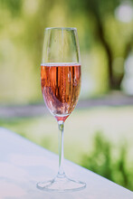 Glass Of Rose Sparkling Wine Outdoor. Celebrating, Relax, Travel Concept