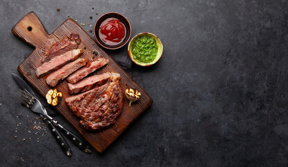 Wall Mural - Sliced beef steak with sauces