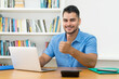 © Daniel Ernst - Optimistic hispanic hipster man with beard working at computer
