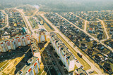 Fototapeta Miasto - Gomel, Belarus. Aerial Bird's-eye View Of Residential Multi-storey Houses And Small Suburb Houses. Cityscape Skyline In Sunny Spring Day
