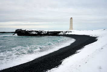 Sticker - Stormy sea near coast with lighthouse in winter