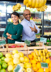 Portrait of happy married couple in grocery supermarket. High quality photo