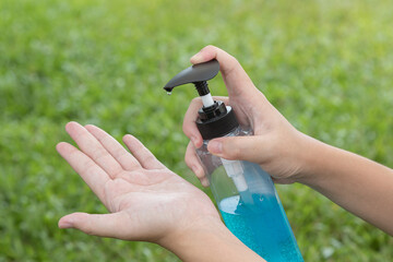 Sticker - The hand is pressing the alcohol gel to prevent the Covid-19 virus.