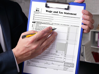  Financial concept meaning Form W-2 Wage and Tax Statement with inscription on the sheet.