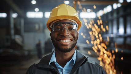 Aufkleber - Portrait Shot of Happy Professional Heavy Industry Engineer/Worker Wearing Uniform, Glasses and Hard Hat in Steel Factory and Smiling on Camera. Industrial Specialist in Metal Construction Manufacture