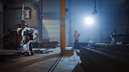 Poster - Black African American Engineer is Testing a Futuristic Bionic Exoskeleton and Picking Up Metal Objects in a Heavy Steel Industry Factory. Contractor is Heavy Lifting Steel Parts in a Powered Shell.