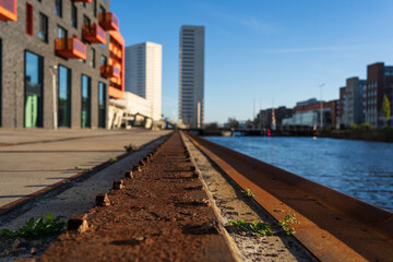 Steel and rust belonging to the old dock in a new, urban development project. Shallow D.O.F.