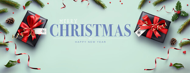 Pale green Merry Christmas website banner background of presents, red ribbon, holly and pine cones.