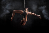 Fototapeta Konie - A female gymnast on an air ring (hoop)