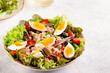 salad Nicoise with tuna, eggs, green beans, tomatoes, olives, lettuce and anchovies