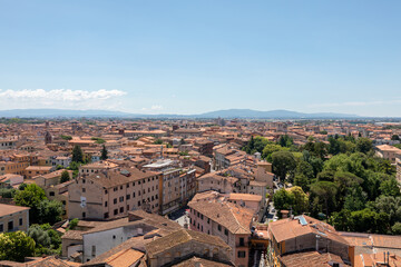 Wall Mural - Panoramic view of Pisa city with historic buildings and far away mountains