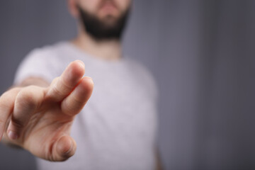 Poster - young man finger pointing touch modern