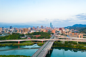 Wall Mural - Taipei City Aerial View - Asia business concept image, panoramic modern cityscape building bird’s eye view under sunrise and morning blue bright sky, shot in Taipei, Taiwan