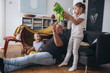 © cherryandbees - father playing with children at home