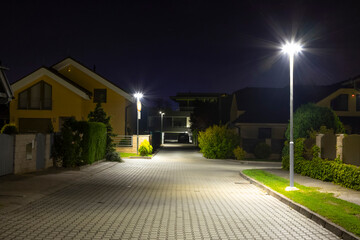 Poster - modern led illumination on quiet street at night