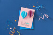 © Maki Company Limited/Stocksy - Greeting card with air balloons congratulation on a blue background.