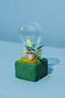 © Maki Company Limited/Stocksy - green energy concept, lightbulb with plant growing inside