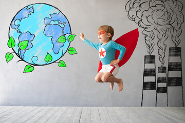 Canvas Print - Superhero child jumping against grey concrete background