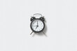 © Yaroslav Danylchenko/Stocksy - Retro alarmclock is showing seven.