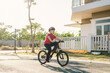 © Maki Company Limited/Stocksy - Urban biking - Young boy riding bike in city park