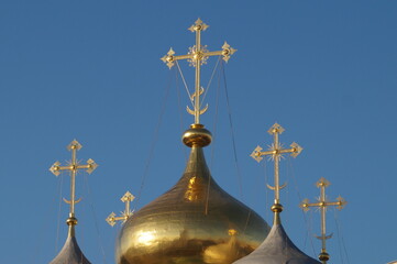 Orthodox Golden cross on the dome of the Church in Moscow, in the Novodevichy monastery on a Sunny day