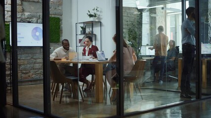 Wall Mural - Diverse Group of Professional Businesspeople Meeting in the Conference Room. Stylish Busy Business Office with Creative People Working on App Design, Data Analysis, Plan Strategy for Social Media