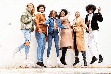 Wall Mural - Group of multiracial happy friends having fun together, smiling.