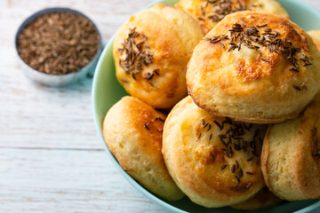 Close up on Cheese Bannocks in plate on rustic wood table copy space