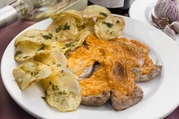 Sticker - Selective focus shot of fried pig meat with a garnish of seasoned chips