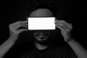 man holding phone in the eyes, blank phone screen on the face, digital and futuristic illustration